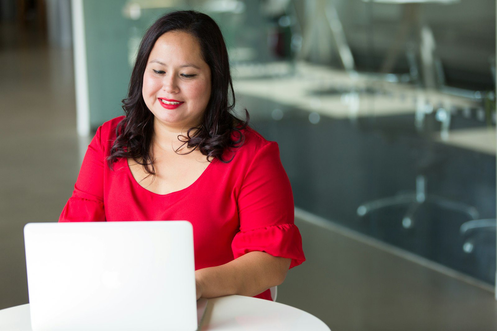 Small business owner at a desk carefully checking marketing an AI tool wrote