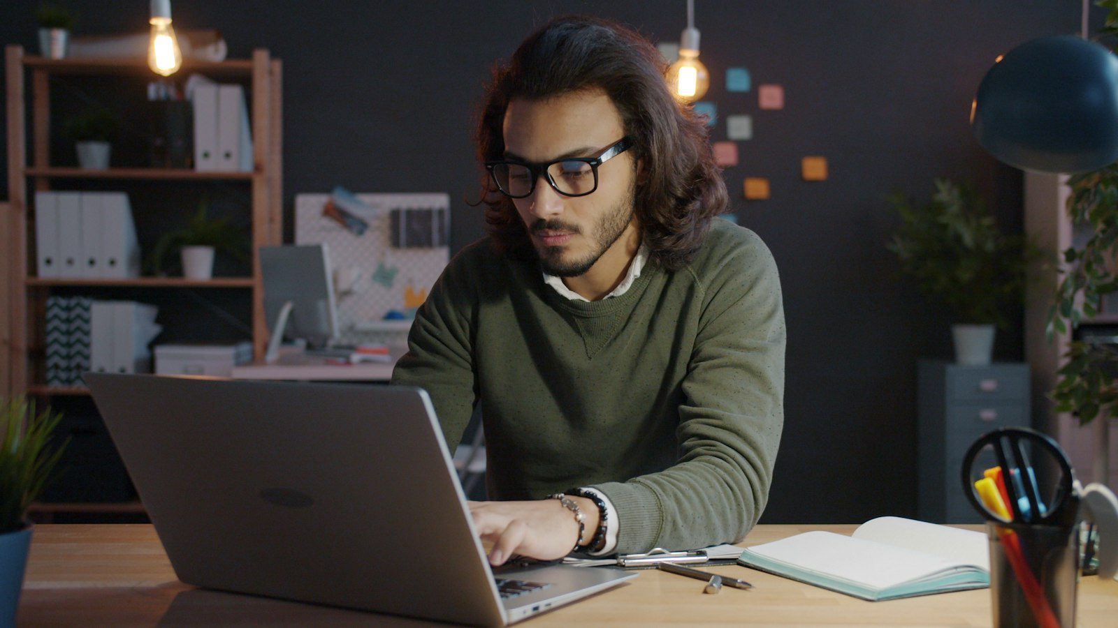 Small business owner working late on a laptop at home